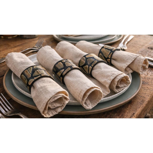 Elevate your tablescape with this set of four natural horn napkin rings, each showcasing beautifully varied grain, warm...
