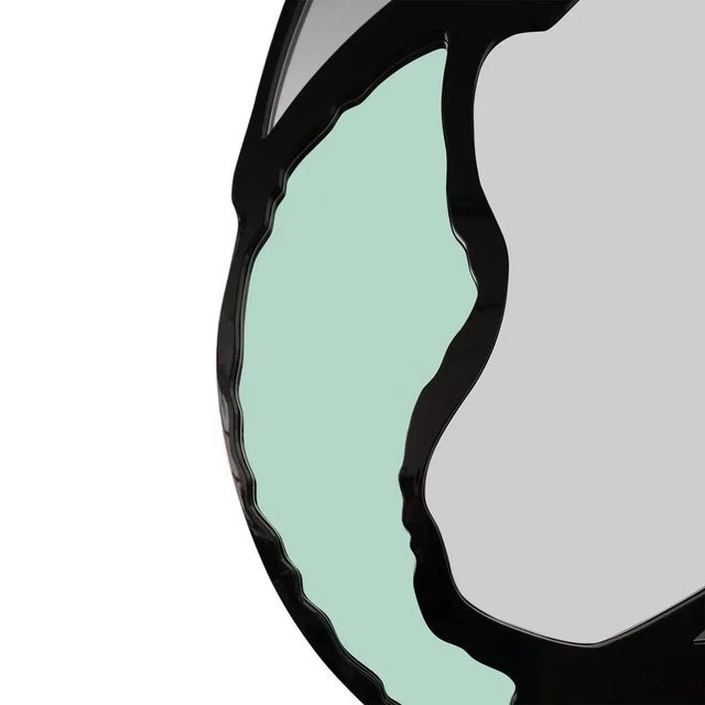 Zadine Mirror is a stylishly shaped modern mirror to add a contemporary and luxurious feeling to your home. This statement...