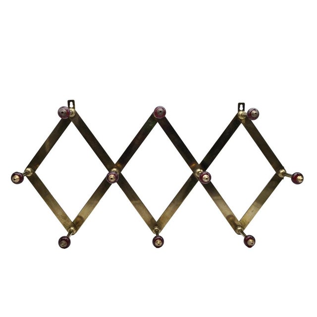 Extremely rare adjustable coat rack model “AT4” designed by Italian architect Luigi Caccia Dominioni and produced by...