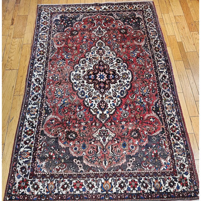 "This striking mid-20th-century Persian Bakhtiari room size rug from Western Persia beautifully showcases the region's...