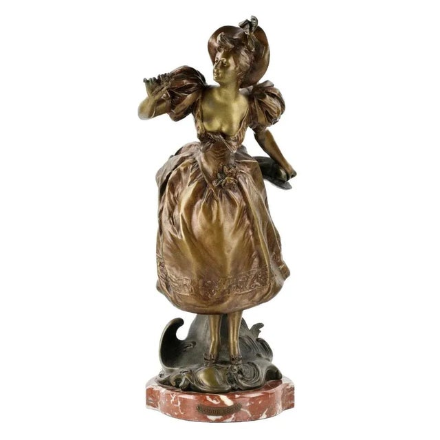 French, bronzed metal figure on a marble base Have a nice holiday. Depicts a playful Parisian - a prankster, with a...