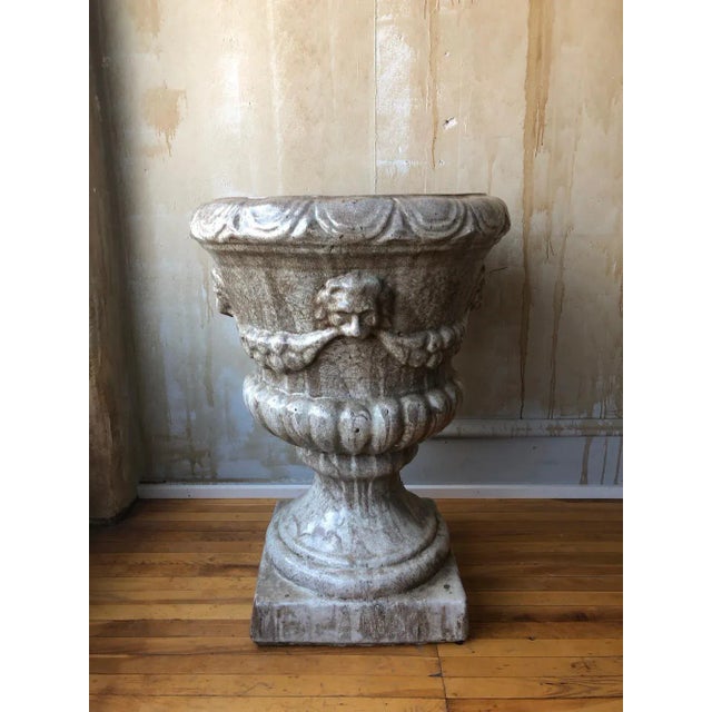 This large antique glazed urn from Italy is impressive and dramatic because of its size and wonderful detailing. The color...