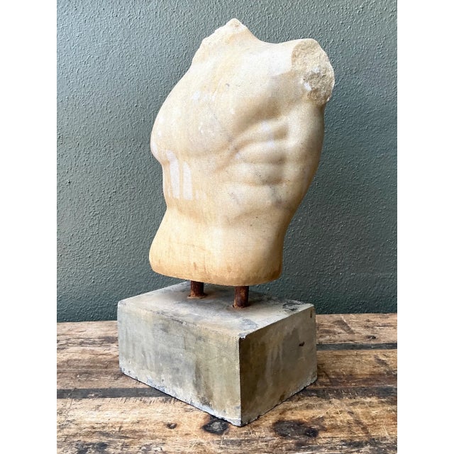 This vintage stone torso sculpture blends classical figurative form with a mid-20th-century contemporary sensibility,...