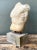 This vintage stone torso sculpture blends classical figurative form with a mid-20th-century contemporary sensibility,...