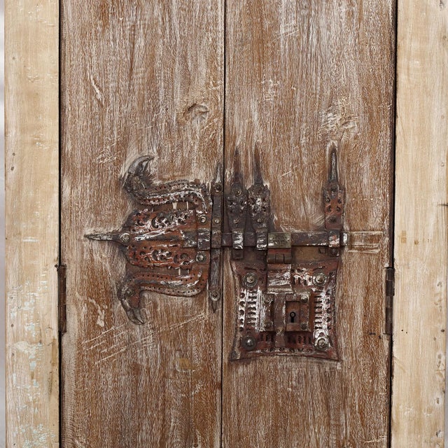 Armoire constructed from antique Indian painted teakwood doors and architectural elements, showcasing the depth, patina,...