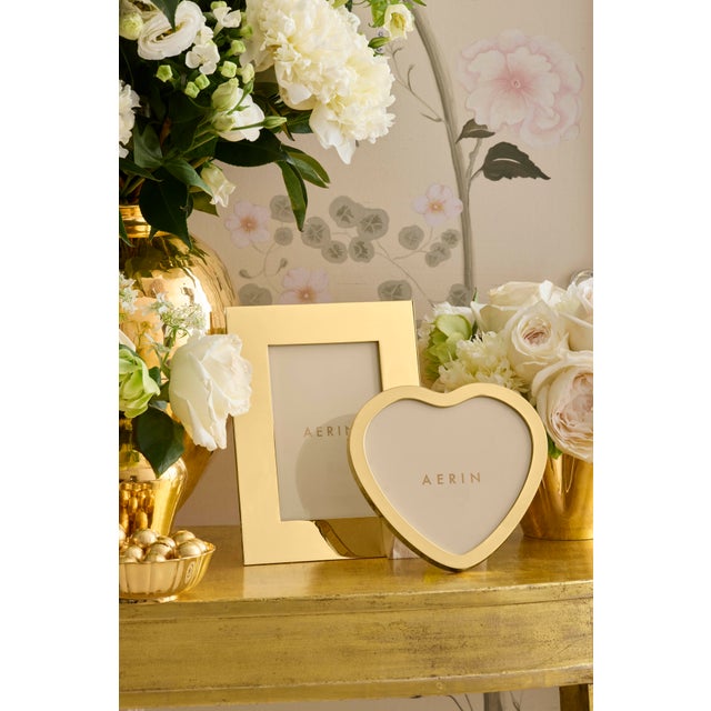 A central motif in the AERIN collection, this heart-shaped gold frame brings a romantic touch to a vanity or desk. It is...
