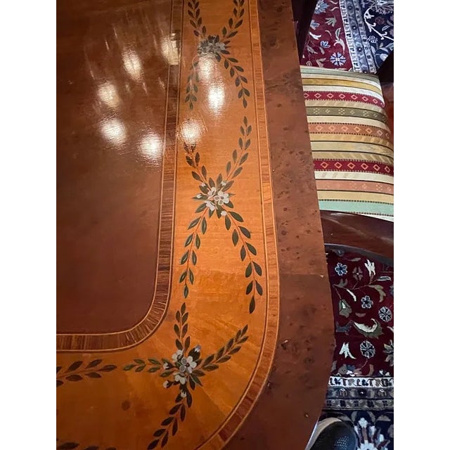 This is a very Elegant Baker mahogany dining table featuring ornate carved edges and pedestal base. Set includes 10...
