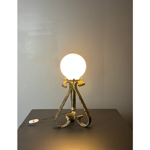 Brutalist Wrought Iron and Opaline Glass Table Lamp, Spain, circa 1960s-1970s Hand-forged table lamp from Spain, made of...