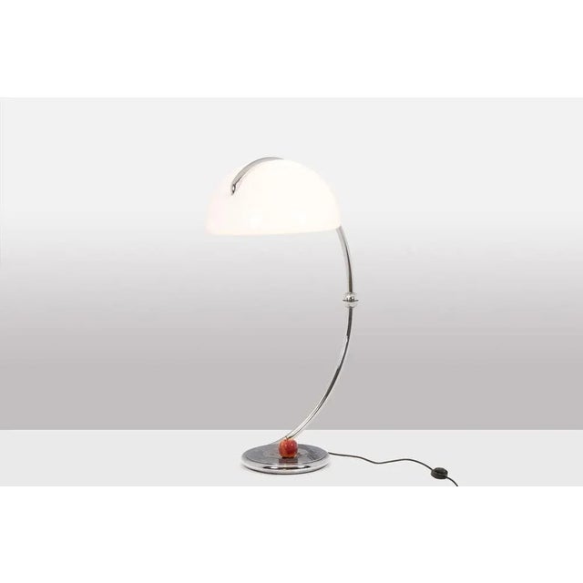 Elio Martinelli, par. Floor lamp in chrome metal and a white ABS lampshade Italian work realized in the 1970s. This piece...