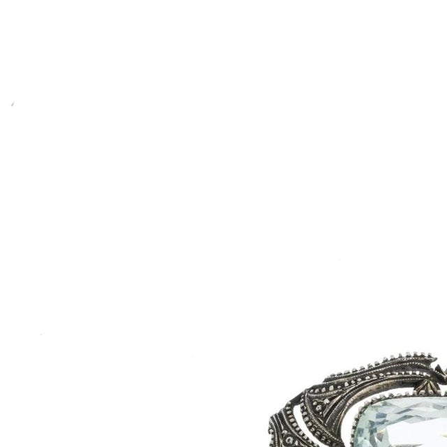 Jewelry - Silver brooch with aquamarine. Europe, first half of the 20th century, in embossed silver, set with oval-cut...