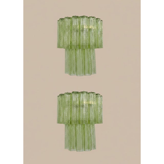 DUTIES FREE A fantastic pair of Italian Murano glass wall sconces featuring an elegant nickel-plated metal structure...
