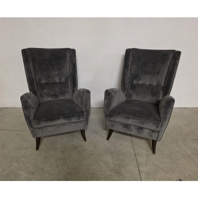 Pair of gio ponti armchairs for isa bergamo. refined 1950s armchairs with high backs in gray velvet. attributed to the...