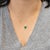 Elegant 1.8Ct Natural Zambian Emerald pendant featuring a beautifully cut round 8mm genuine emerald, showcasing a rich,...