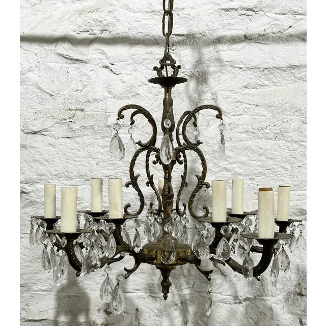 8” chain 17” across 17” tall 24” wire Good condition This large, ornate 10-light fixture features a beautifully detailed...