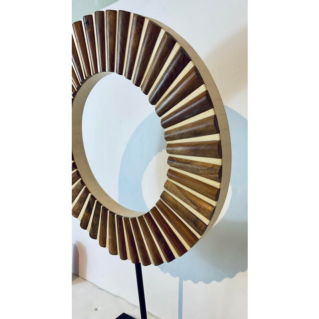 Stylish Currey & Company Modern Large Wood and Bone Ring on Stand, black metal stand, showroom floor sample