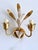 Italian gilt and white lacquered tôle two-light wall sconce attributed to Masca, 1970s. Hand-formed botanical leaves with...