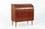 This vintage mid century Scandinavian modern teak wood rolltop secretary desk cabinet by Egon Ostergaard was made in...