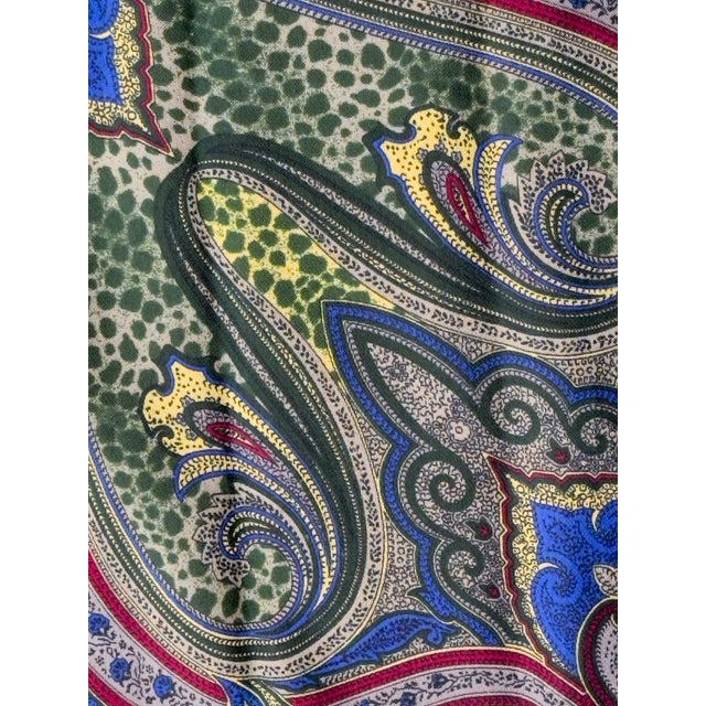 Vintage handkerchief scarf in a green paisley pattern with yellow, blue, and red accents. Made in Italy, 1980s. This...