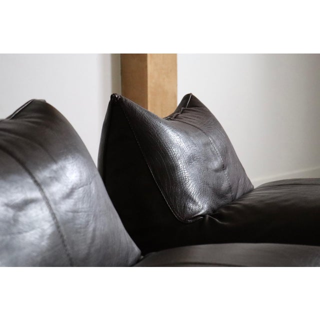 Beautiful pair of “Le Bambole” lounge chairs in original buffalo leather, designed by Mario Bellini and produced by B&B...