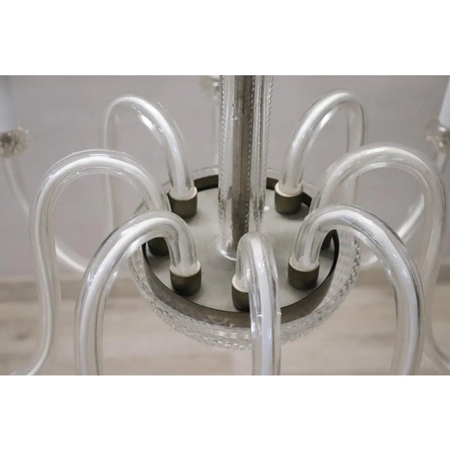 Beautiful and refined murano glass chandelier 1980s total eight lights. The chandelier is made with the classic artistic...