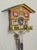A 1970s West German Hofbräuhaus chalet cuckoo clock with a yellow body, green roof, lion emblem, beer drinkers on the...