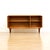 A teak low console credenza by White & Newton. Produced in the 1970s this superbly crafted, low credenza has front doors...