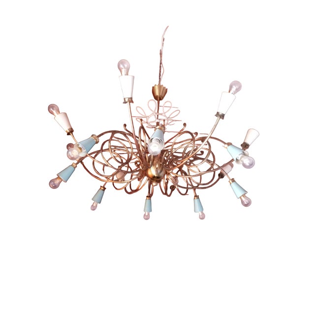 This chandelier is an elegant vintage piece from the 1950s, inspired by the style of great designers of the era such as...