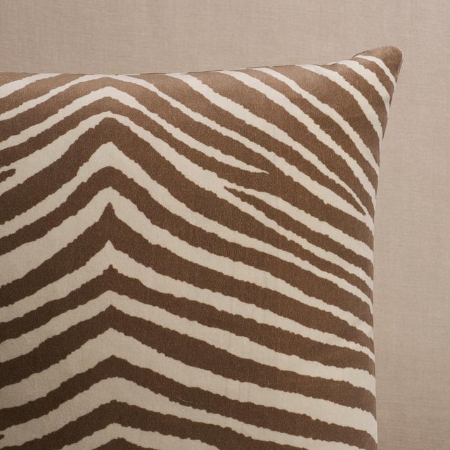 This pillow features Blixen Velvet with a Knife Edge finish. A classic animal pattern screen-printed on low-pile cotton...