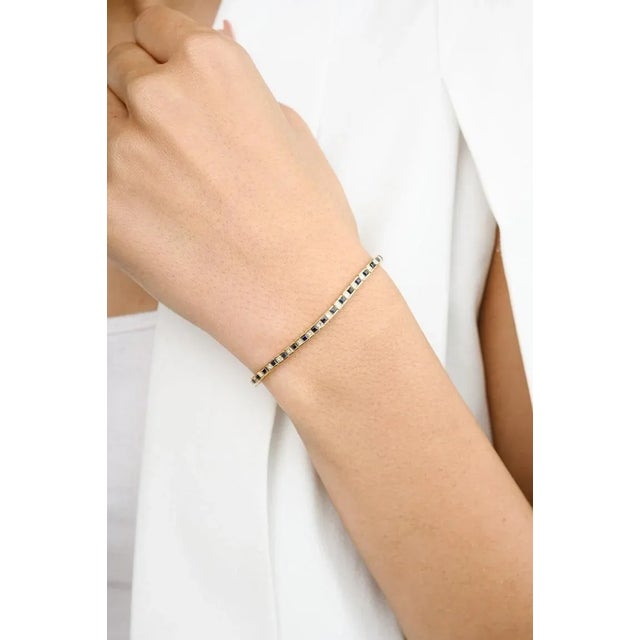 This is part of Chairish’s Fine Jewelry assortment. This Blue Sapphire and Diamond Line Bracelet in 18K gold showcases...