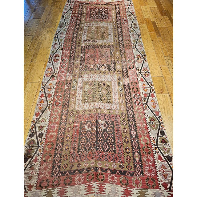This magnificent antique Turkish kilim from the first quarter of the 20th century is one of the finest examples of early...