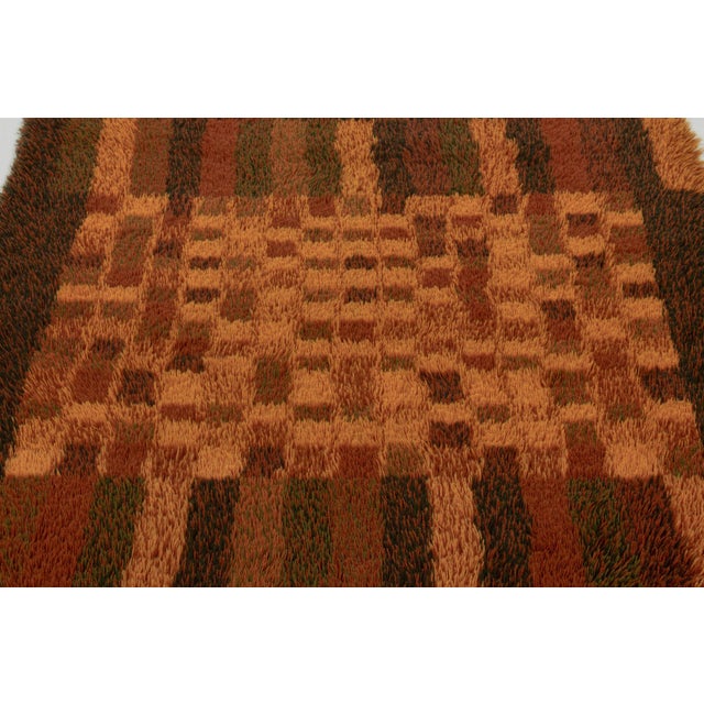 Hand-knotted in high-pile wool in Sweden circa 1960-1970, this 5x7 vintage Swedish Rya rug is a bold new addition to Rug &...