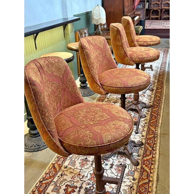 Newly upholstered bar height stools with antique cast iron bases. Extremely comfortable and sturdy. Reupholstered and...