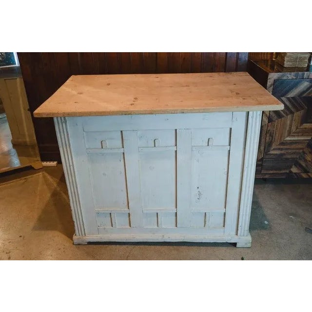 This wonderful antique shop counter/desk has a light three plank pine top and an antique painted finish on the bottom. The...