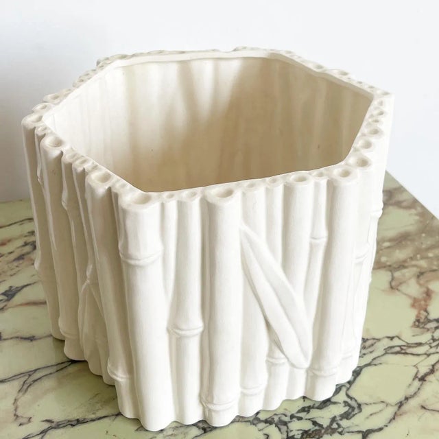 Wonderful vintage boho chic regency ceramic hexagonal vase. Features a faux bamboo sculpted throughout the sides.