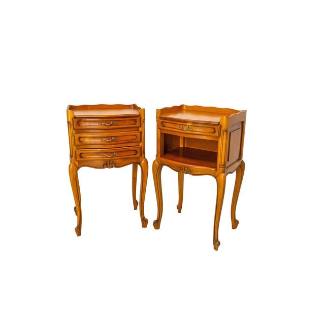 French side cabinets nightstand of 1970s. Massive cherry wood and brass louis XV style. The pair match, but each bedside...