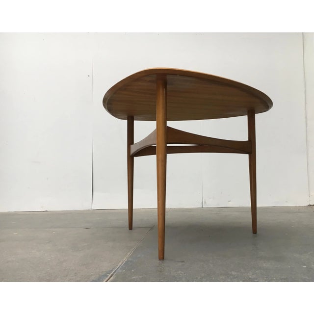 Mid-century tripod table. Very elegant design language, especially in the finish of the table top and the interaction of...