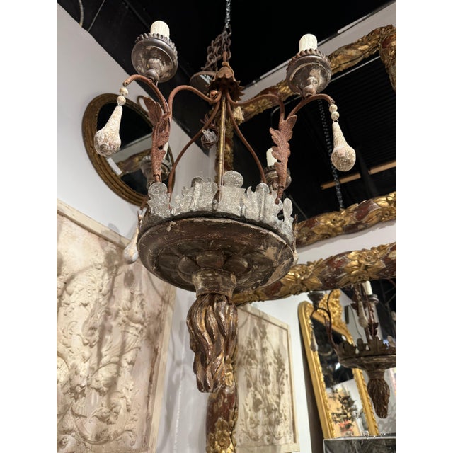 French 4-light 19th c chandelier. Gilt wood on iron base. Rich rusted and weather patina. Newly rewired. 23”dia x 38”h 45-250