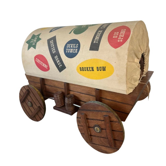 Great MidCentury Modern Stealth Bar in the form of a Covered Wagon, heading west in America. This little bar appears never...