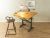 A classic drafting table from the 1950s. High-quality steel construction with a drawing board and a lamp. The frame is...