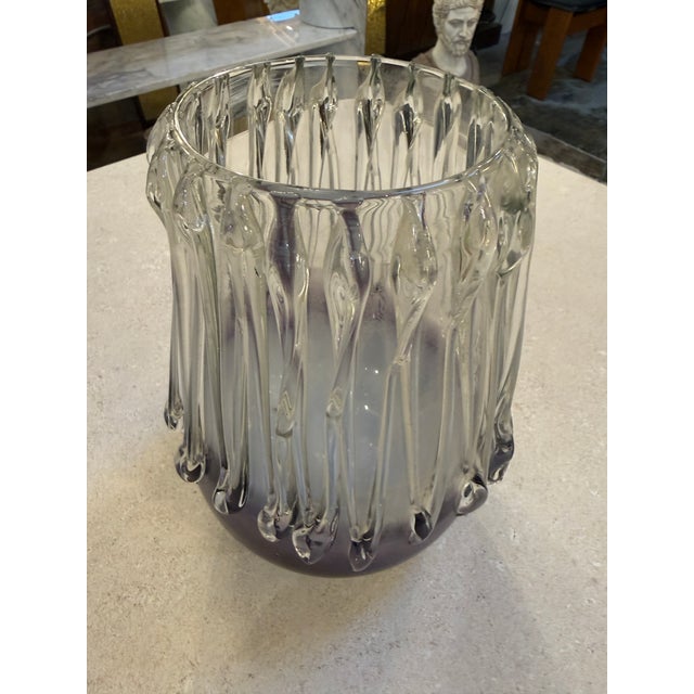 A refined Murano glass vase crafted in Italy during the 1970s, distinguished by its dramatic vertical sculptural ridges...