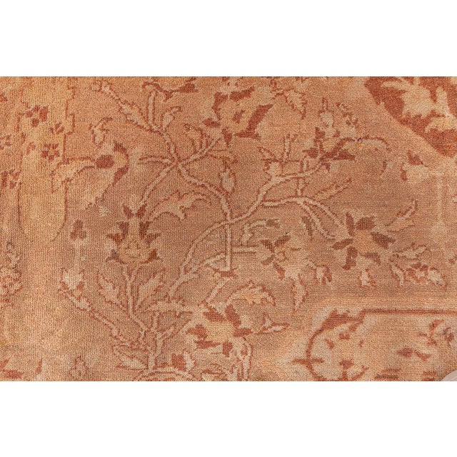 A fine example from our selection of late 19th century Indian Amritsar antique rugs, the camel field with cypresses and...