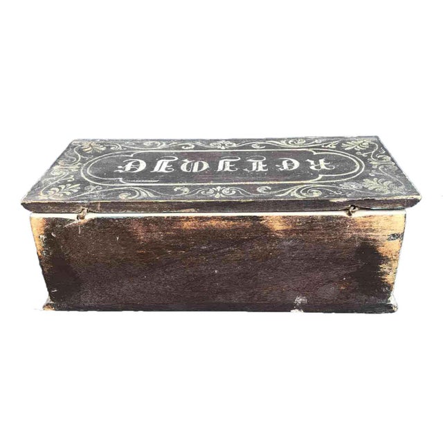 A 19th-century French lacquered relic box, crafted from oak and lacquered in a gray/monk's habit background with palmettes...