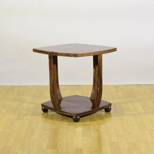 This solid coffee table, dating back to the early 1900s, is a fine example of period furniture crafted from solid wood....