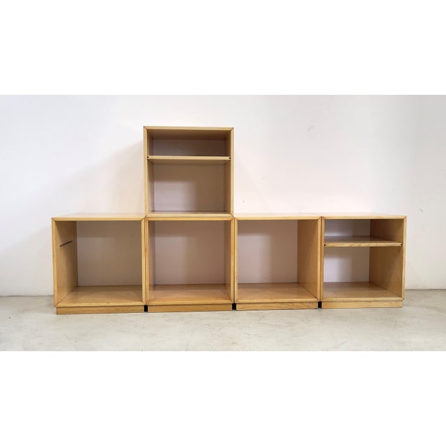 Ash wood wall bookcase. Designed by G. Offredi. Made by Saporiti Italia. 1970s. This piece is attributed to the mentioned...