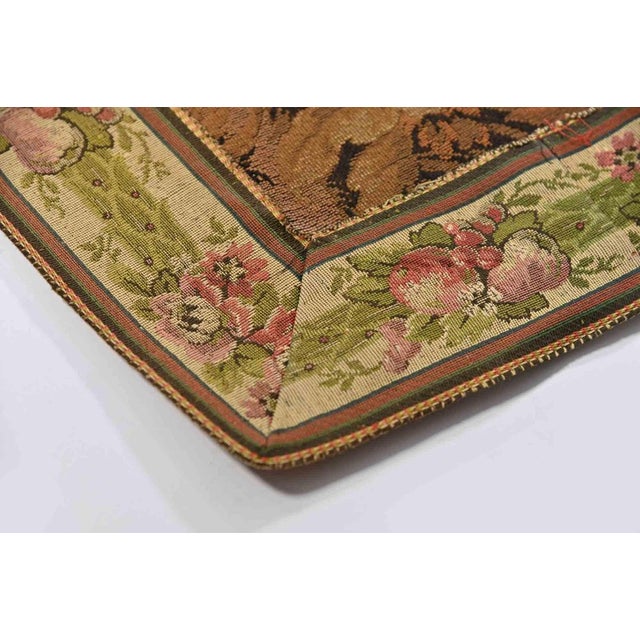 Tapestry of 1950s representing a bucolic scene with three figures. Elaborate weaving in shades of brown and orange with...