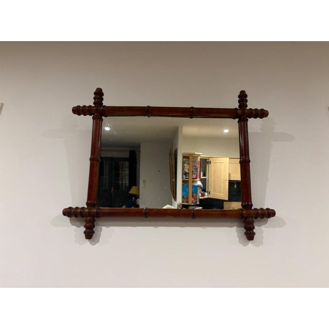 A charming rectangular wall mirror in the Napoleon III style, a distinctive piece typical of the Orientalist taste that...