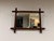 A charming rectangular wall mirror in the Napoleon III style, a distinctive piece typical of the Orientalist taste that...