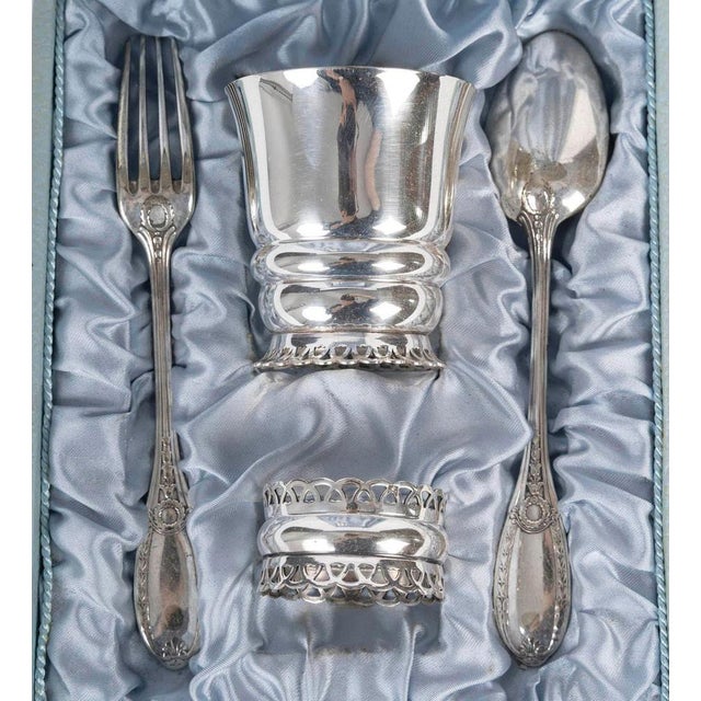 Baptism set, consisting of a cup, fork, spoon, and napkin ring. Baptism set in its original silver-plated metal box, early...
