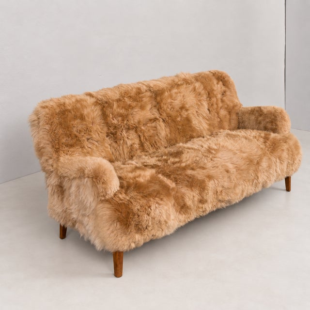 The three-seater sofa was designed by Orla Mølgaard-Nielsen and his partner Peter Hvidt for the legendary manufacturer...