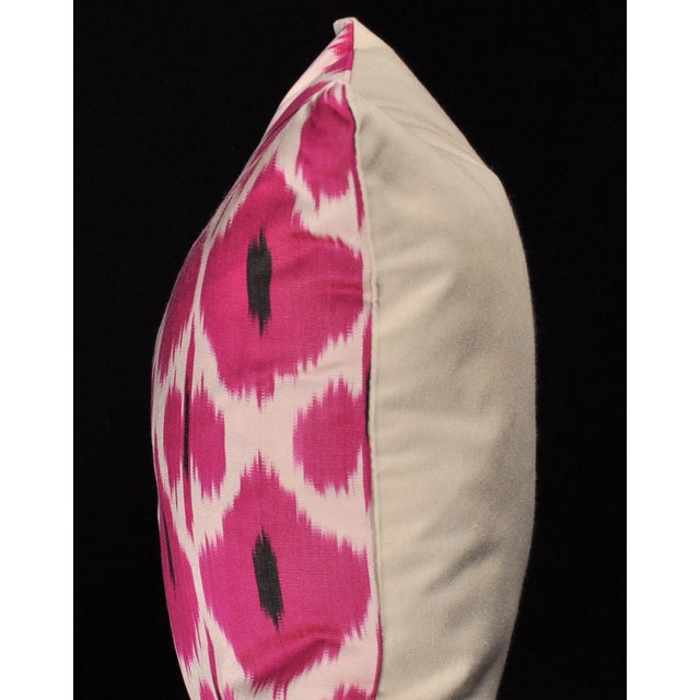 Beautiful Turkish Silk Ikat-weave square pillow in magenta, black and cream in a repeating pattern. The process of Ikat...